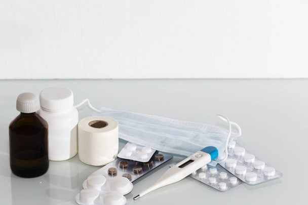 digital thermometer, empty medicine blister and bottles, pills - Фото, изображение