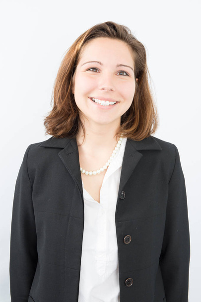 Portrait of a young confident business woman smiling - Фото, изображение