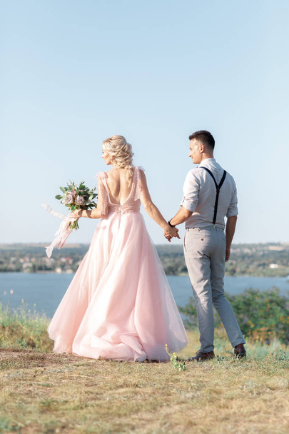 wedding couple on the nature in summer day. - Photo, Image