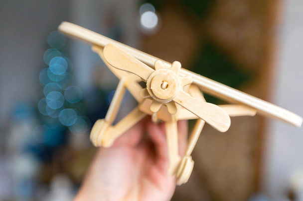 close up of  toy airplane in hand - Zdjęcie, obraz