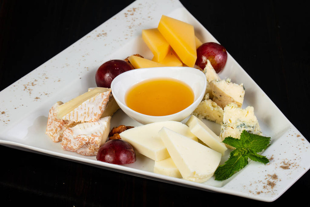 Cheeses plate mix - brie, parmesan, blue - Photo, Image