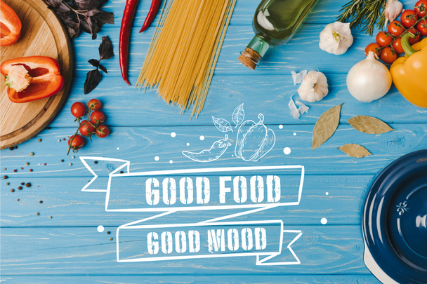 top view of ingredients for cooking pasta on blue table, good food good mood lettering - Fotoğraf, Görsel