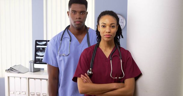 Portrait of two African American medical specialists standing in hospital - Photo, Image