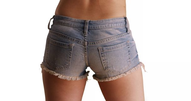 Rear view close up of woman wearing denim shorts for copy space - Foto, immagini