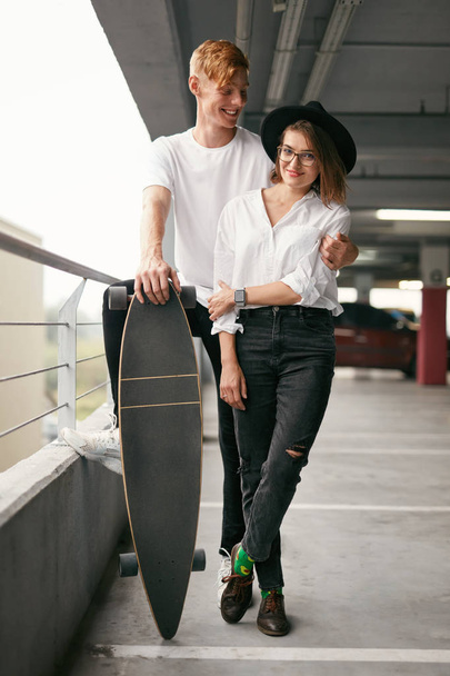 Casual Fashion Clothing. Young Couple In Stylish Clothes Indoors - Foto, afbeelding