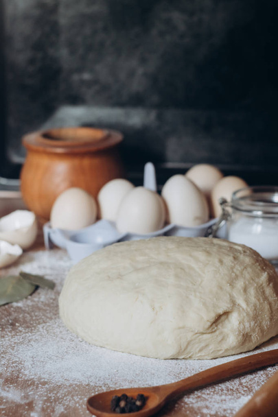 Raw dough with butter, flour and eggs on wooden table - Fotoğraf, Görsel