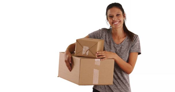 Beautiful smiling Caucasian woman holding shipping boxes on white background - Photo, Image