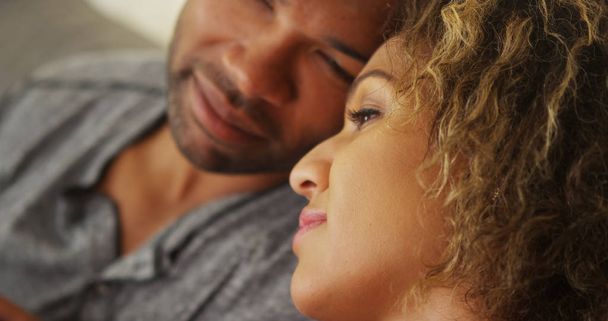 Black couple resting their heads together - Foto, Imagen