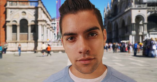 Wide angle of Latin male in St Marks square looking directly at camera - Photo, Image