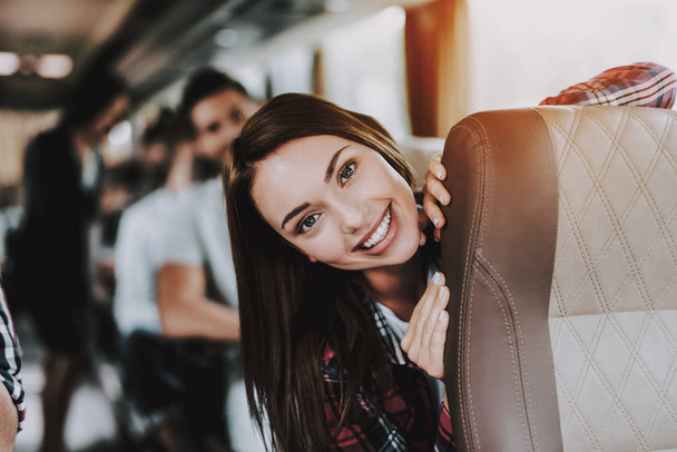 Young Smiling Woman Traveling on Tourist Bus. Happy Beautiful Woman having Fun on Passenger Seat of Tour Bus. Traveling, Tourism and People Concept. Friends on Trip. Happy Summer Vacation - Foto, imagen