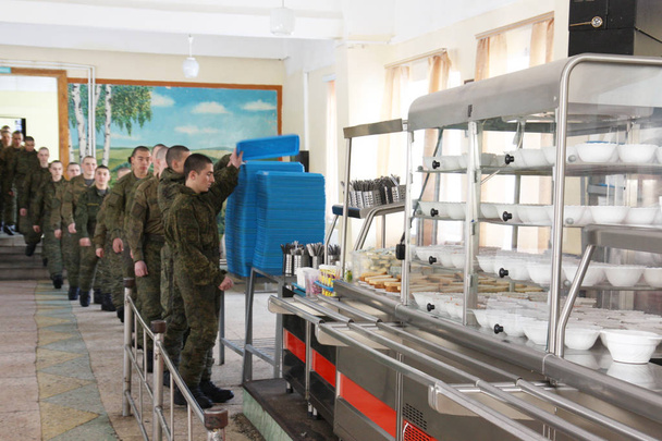 Orenburg, Russia, 05/16/2008. Dining room in a military unit . EditorialDining room in the army, food soldiers. Russian dining room in the division of rocket troops. Dinner conscripts and contract soldiers. - Foto, imagen