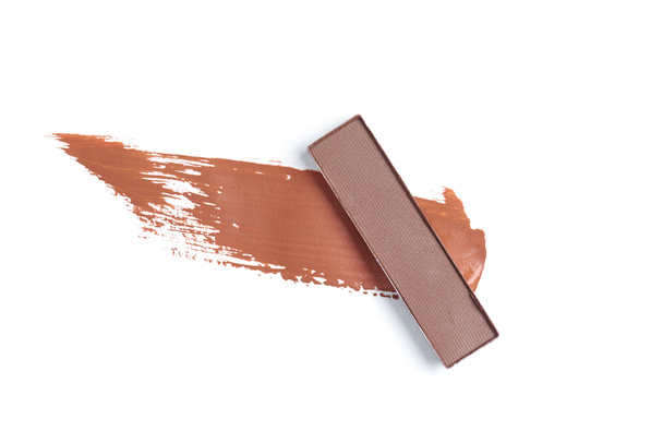 top view of eyeshadow of brown color with stroke on white background - Valokuva, kuva