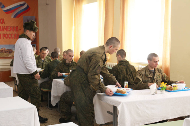 Orenburg, Russia, 05/16/2008. Dining room in a military unit . EditorialDining room in the army, food soldiers. Russian dining room in the division of rocket troops. Dinner conscripts and contract soldiers. - Foto, imagen