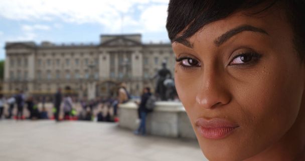 Close-up of serious black female gazing intently at camera in London UK - Foto, Imagem