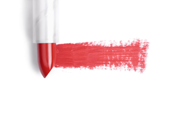 top view of red lipstick stroke on white backdrop - Photo, Image