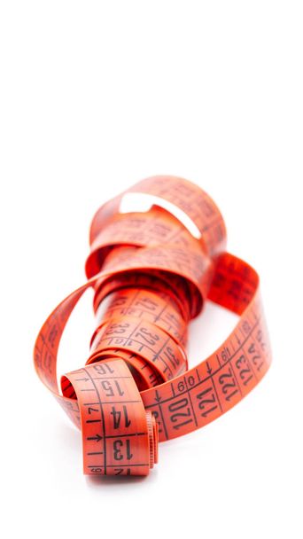 blur red  tape measure in the white light like concept of diet and lenght tool   and copy spac - Foto, immagini