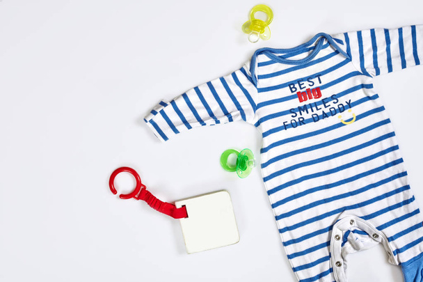 Baby care accessories and clothing on light background, top view - Photo, Image