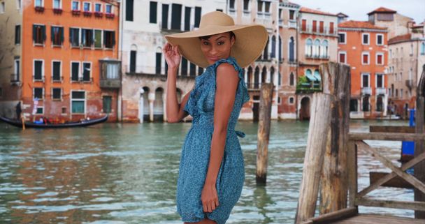 Youthful black female shows off dance moves outside in Venice Italy - Photo, Image