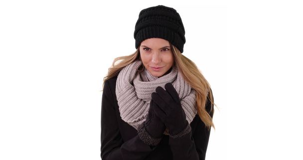 Beautiful Caucasian woman wearing cozy hat and scarf in studio - Photo, image
