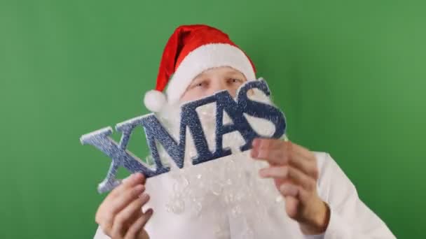 Happy man like a Santa Claus, xmas and christmas 2019, on green Chroma key - Felvétel, videó