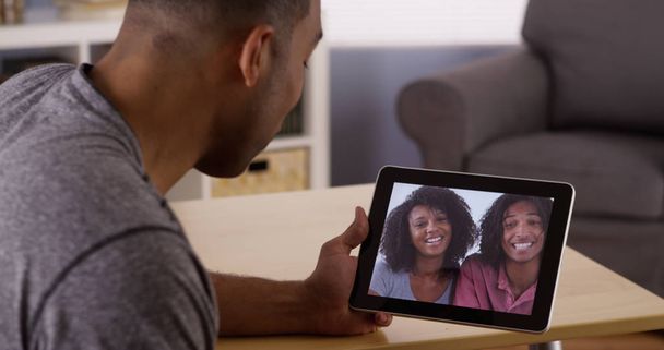 Black friends video chatting on tablet - Photo, Image