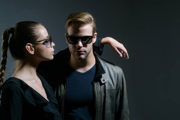 Real love. Fashion models in trendy sun glasses. Couple in love. Couple of man and woman wear fashion glasses. Love relations. Friendship day. Friendship relations. Feeling flirty - Photo, Image