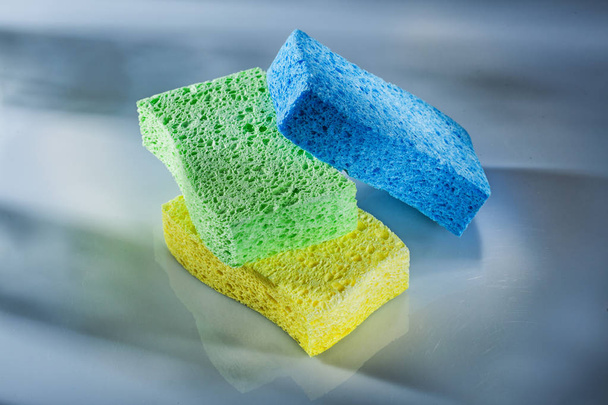 New sponges on white surface. - Foto, afbeelding