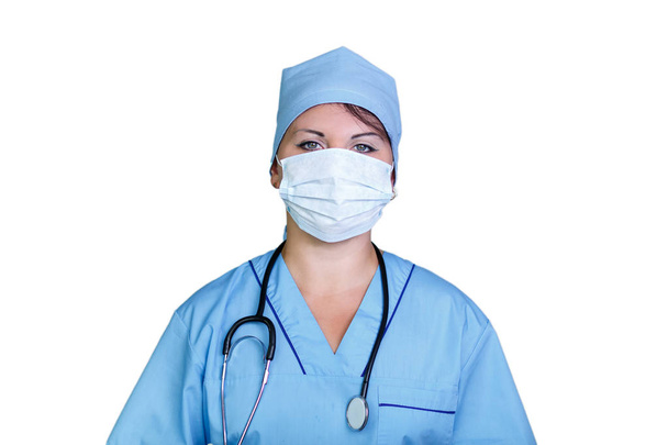 Young smiling female doctor in medical mask on white background. horizontal photo. - Foto, afbeelding