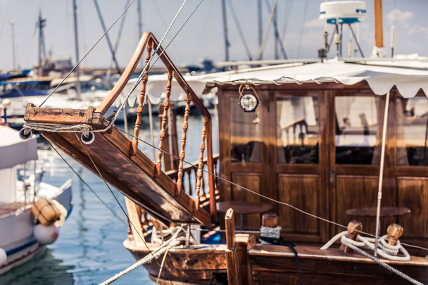 Authentic wooden boat sailing ship in the harbor at sea - Photo, Image