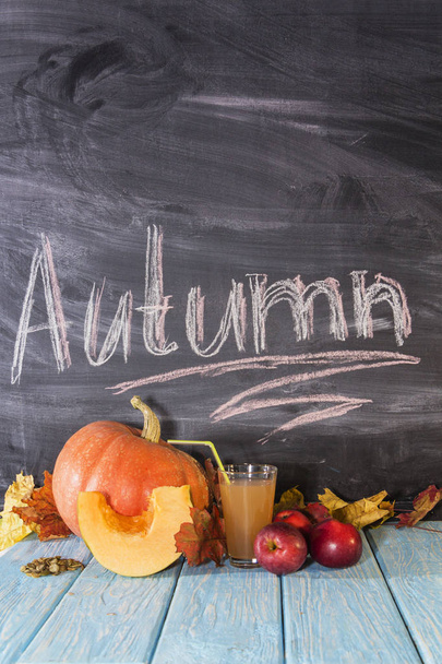 On the table are apples and pumpkins. Autumn still life. Autumn calendar. - Zdjęcie, obraz