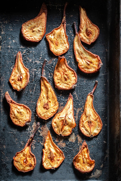 Enjoy your sun dried pears on old baking tray - Foto, imagen