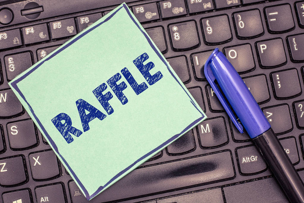 Writing note showing Raffle. Business photo showcasing means of raising money by selling numbered tickets offer as prize - Photo, Image
