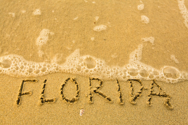 Флорида - написано в пісок пляжу текстурою - м'які морської хвилі. - Фото, зображення