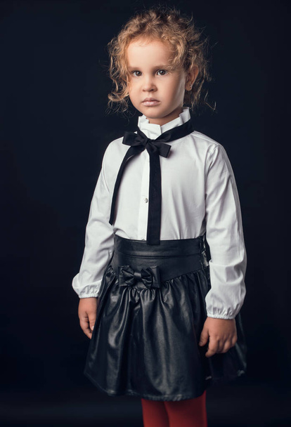 child in the Studio posing in fashionable clothes - Foto, afbeelding