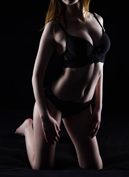 Photo of young woman in black underwear - Zdjęcie, obraz