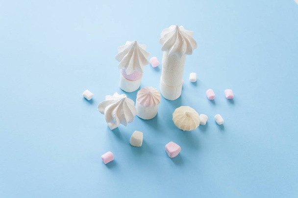Pastel food set of colorful marshmallow on blue background. Dessert, minimalistic design. - Foto, Imagem