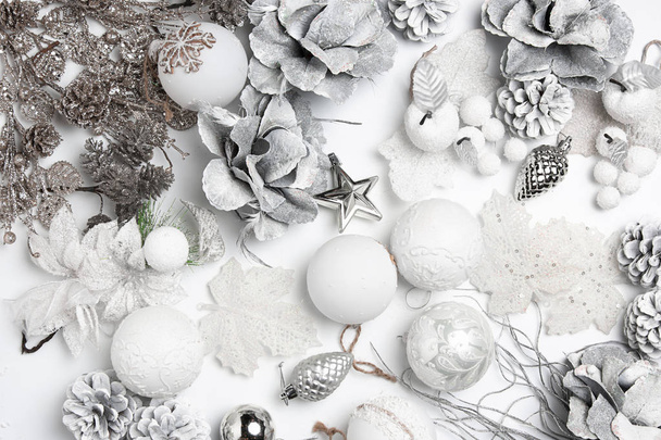 Christmas decorative composition of toys on a white background surrealism. Top view - Foto, immagini