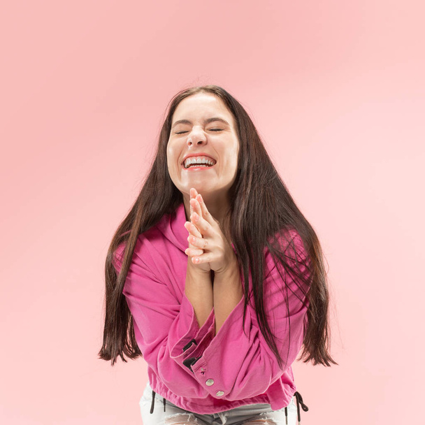 I won. Winning success happy woman celebrating being a winner. Dynamic image of caucasian female model on pink studio background. Victory, delight concept. Human facial emotions concept. Trendy colors - Zdjęcie, obraz