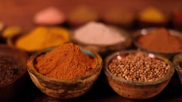 Variety of aromatic spices and herbs on kitchen table - Footage, Video