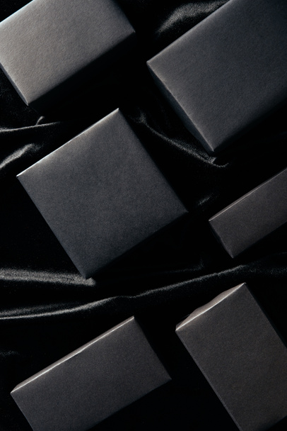 flat lay with blank boxes on black  backdrop, black friday concept - Valokuva, kuva