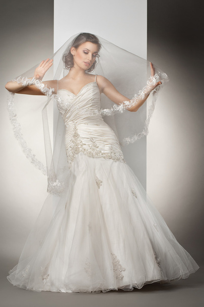 The beautiful young woman in a wedding dress - Fotó, kép