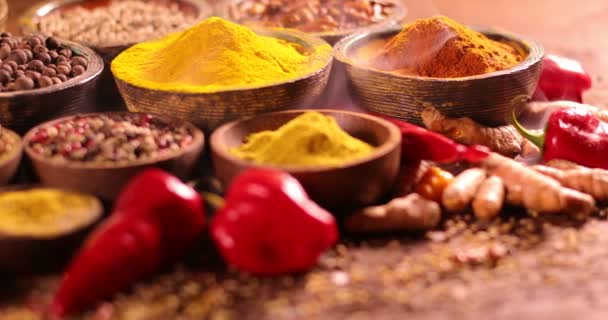 Variety of aromatic spices and herbs on kitchen table - Footage, Video