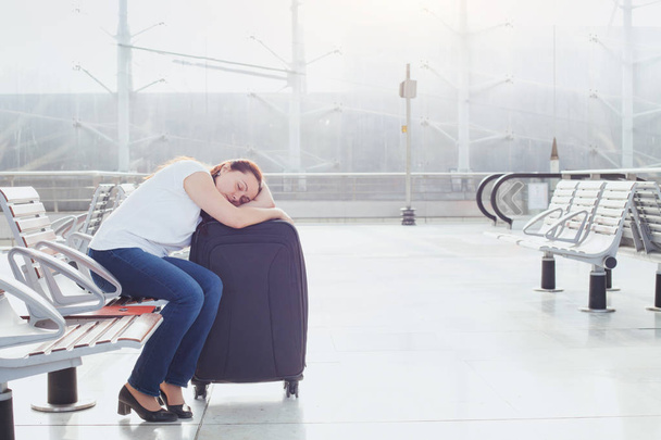 woman sleeping in the airport, transit passenger - Valokuva, kuva