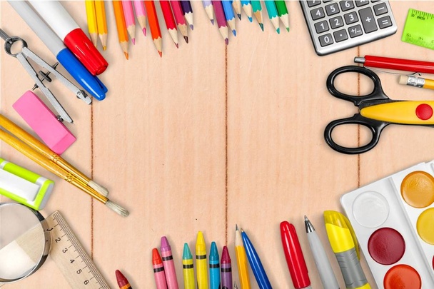 School stationery composition on wooden background - 写真・画像