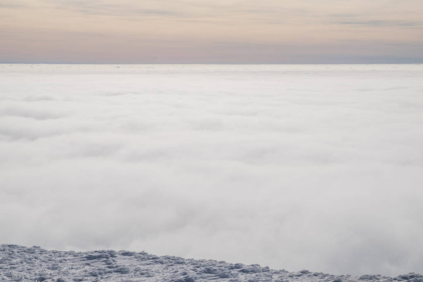 Above white heavy clouds. Panorama of cloudscape from the top of the mountain. - Foto, immagini