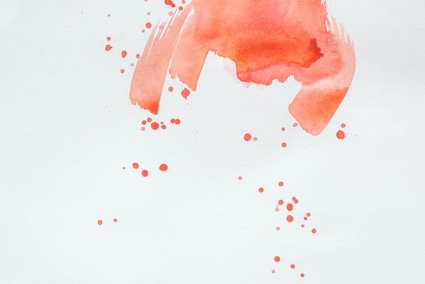 abstract red watercolor splatters on white paper - Фото, зображення