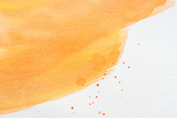 abstract orange watercolor painting with paint blots on white paper - Foto, imagen
