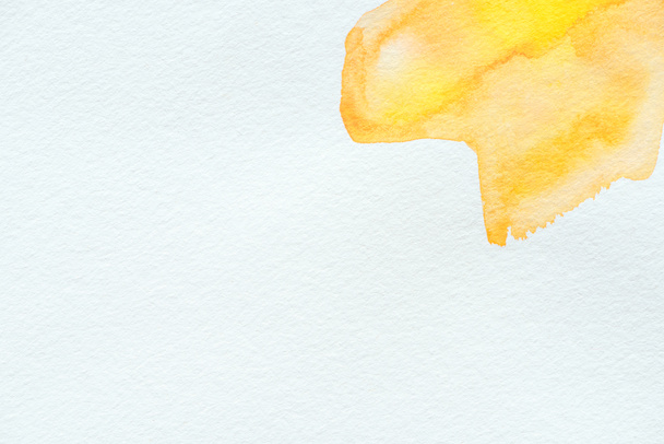 abstract yellow watercolor strokes on white paper background - Photo, Image