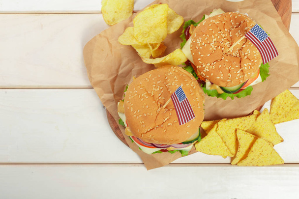 Fast food, homemade burger on a wooden background - Fotografie, Obrázek