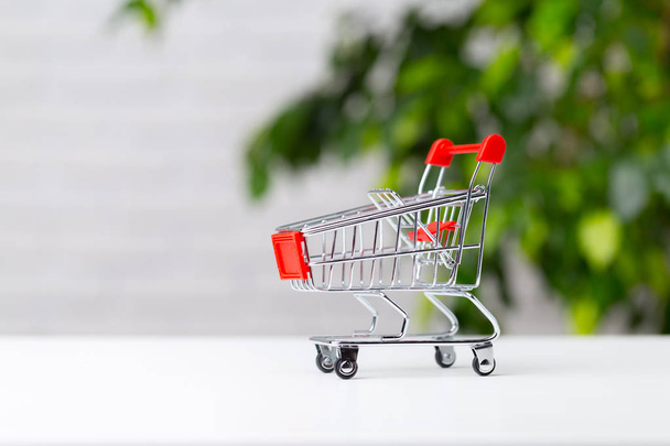 Empty Shopping Cart on background,close up - Foto, imagen